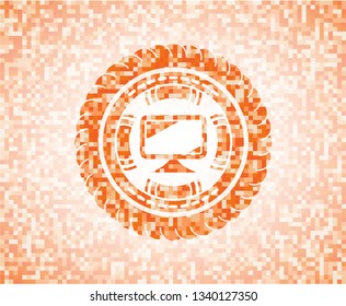 monitor icon inside abstract orange mosaic emblem