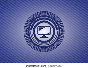 monitor icon inside badge with denim texture