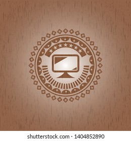 monitor icon inside badge with wooden background