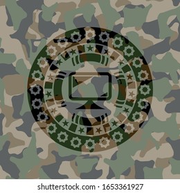 monitor icon inside camouflage emblem