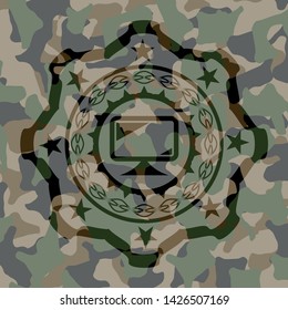 monitor icon inside camouflaged emblem