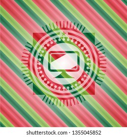 monitor icon inside christmas badge background.