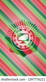 monitor icon inside christmas badge.