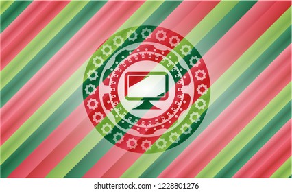monitor icon inside christmas colors badge.