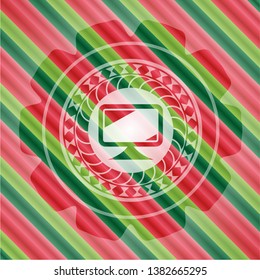monitor icon inside christmas colors badge.