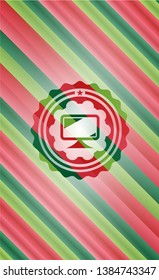 monitor icon inside christmas colors style badge.