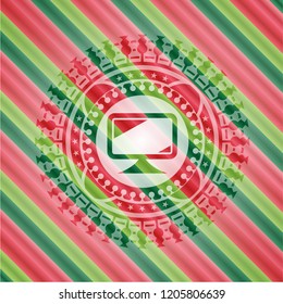 monitor icon inside christmas emblem background.