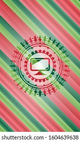 monitor icon inside christmas style emblem.