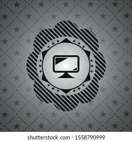 monitor icon inside dark emblem