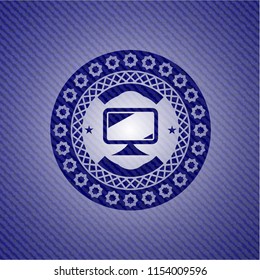 monitor icon inside emblem with denim texture