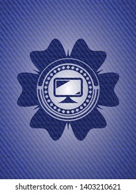 monitor icon inside emblem with jean background