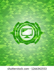 monitor icon inside green mosaic emblem