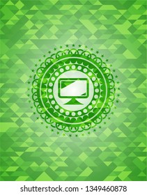monitor icon inside green mosaic emblem