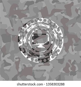 monitor icon inside grey camouflaged emblem