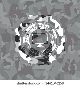 monitor icon inside grey camouflaged emblem