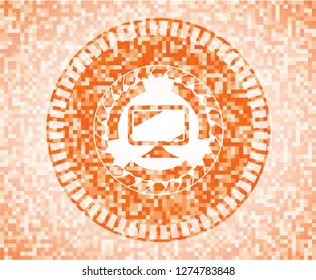 monitor icon inside orange mosaic emblem