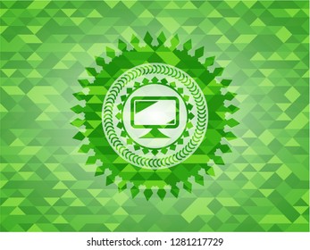 monitor icon inside realistic green emblem. Mosaic background