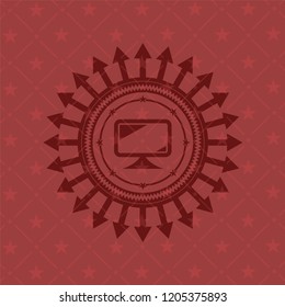 monitor icon inside red emblem