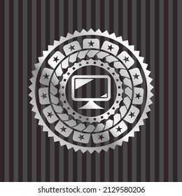 monitor icon inside silver badge or emblem. 