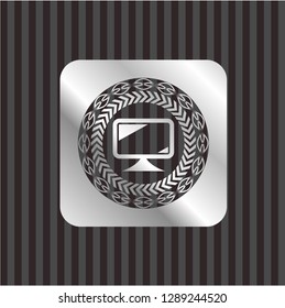 monitor icon inside silver emblem