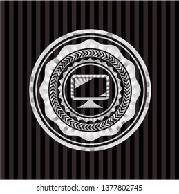 monitor icon inside silver emblem