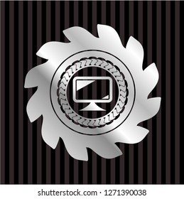 monitor icon inside silvery badge