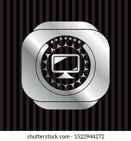 monitor icon inside silvery badge or emblem