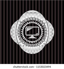monitor icon inside silvery emblem or badge