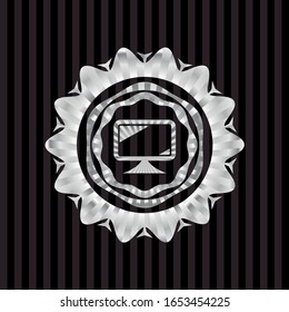 monitor icon inside silvery emblem