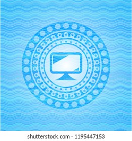 monitor icon inside sky blue water badge background.