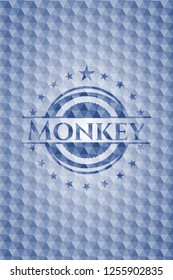 Monkey blue badge with geometric pattern.