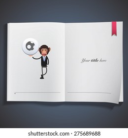 Monkey holding a button and printed on book