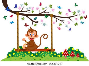 Monkey sitting on a swing and eat banana at the park