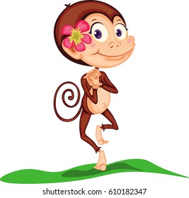 The monkey is standing on the grass