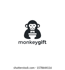Monkey wearing tuxedo holding box present