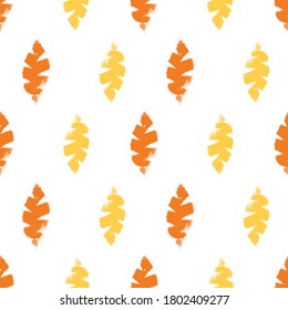 Mono print style leaves seamless vector pattern background. Textured cut out yellow, orange foliage on white backdrop. Hand crafted painterly stamp geometric design. For summer or fall products