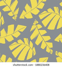 Mono print style scattered leaves seamless vector pattern background. Textured cut out yellow foliage on grey backdrop. Hand crafted painterly design. All over print for fall products