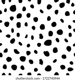 Monochromatic black and white hand drawn polka dot circle motif. Irregular layout, random composition, cool op art design style. Elegant stylish timeless vector. Classic seamless pattern with a twist.