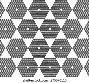 Monochrome abstract geometrical pattern. Modern gray seamless background. Flat simple design.Gray small hexagons forming hexagons.