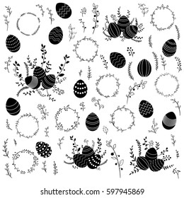 monochrome black silhouettes of vector easter eggs and floral elements isolated at white background