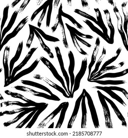 Monochrome botanical seamless pattern with long tropical leaves. Jungle simple black and white ornament. Handdrawn plant elements painted with a brush. Nature ornament for fabric, wrapping and textile