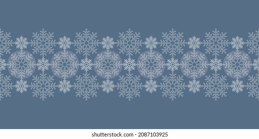 Monochrome Christmas seamless vector pattern Border with white lace snowflakes and circles on blue background. Great for greeting cards, Christmas and New Year cards, invitations and wrapping paper.