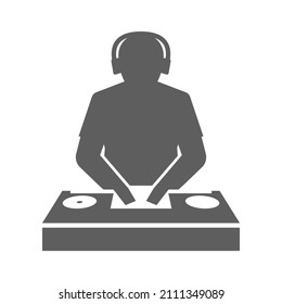 Monochrome club dj behind console mixing music icon vector illustration. Simple logotype disk jockey in headphones playing audio sound scratching vinyl isolated. Nightclub entertainment disco party