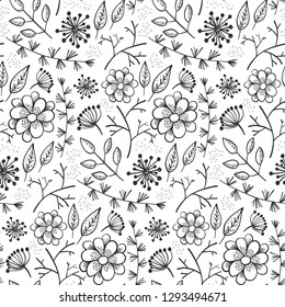 Monochrome doodle floral seamless pattern with outline black flowers and leaves on white background. Lovely floral texture with blossoms and herbs for textile, wrapping paper, surface, wallpaper