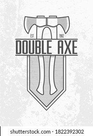 Monochrome Double ax logo on grey wall background. Two axes with a wooden handle on lined shield emblem design. Carpentry tool insignia