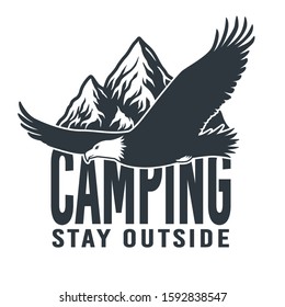 Monochrome emblem flying wild eagle and mountain for camping