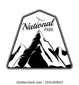 Monochrome emblem of national park in flat style with silhouettes of mountain peaks vector illustration