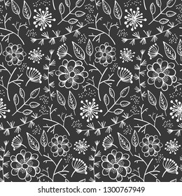 Monochrome floral seamless pattern with outline doodle white flowers and leaves on black background. Lovely floral texture with blossoms and herbs for textile, wrapping paper, surface, wallpaper