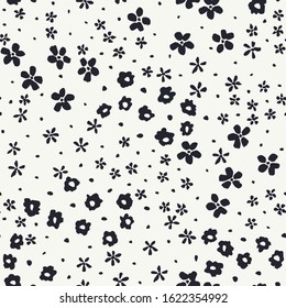 Monochrome graphic abstract ditsy daisies floral vector seamless pattern. Simplistic hand painted black blooms, marks, spots and dots on white background. Loose minimal stylized artistic flowers print