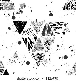 Monochrome graphic seamless pattern with textured hand drawn with ink triangles